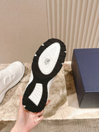 White slip-on sneaker outsole close-up with black rubber tread pattern