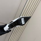 White pointed-toe slingback heel with black outsole