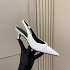 White pointed-toe slingback heel with bow strap