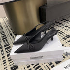Women's black slingback heels with bow, pointed toe, mid heel
