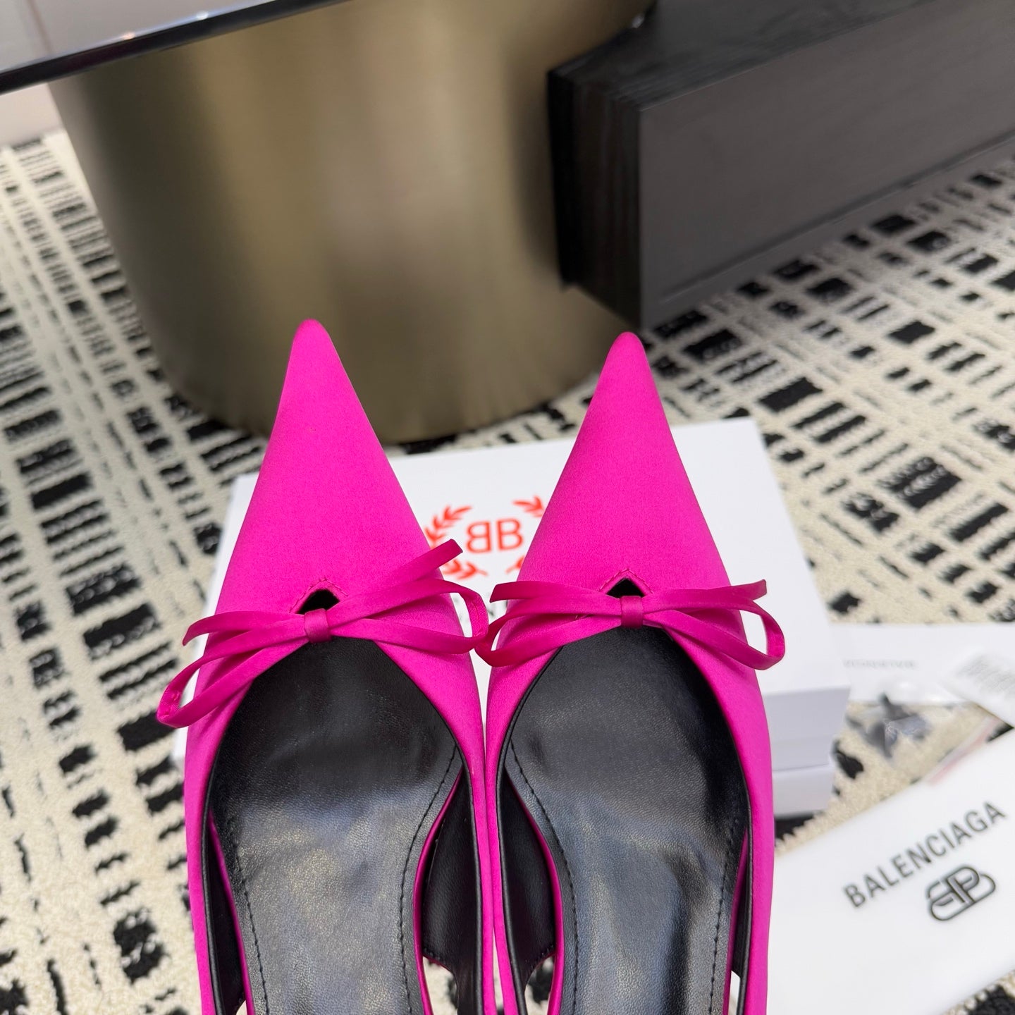 Women's hot pink slingback pumps with bow ties and black sole trim