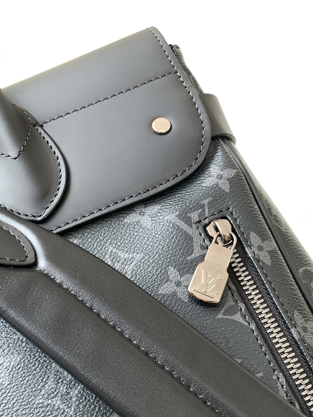 Louis Vuitton men's monogram bag with zip pull, snap pocket flap, and metal key