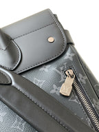 Louis Vuitton men's monogram bag with zip pull, snap pocket flap, and metal key