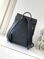 Louis Vuitton bag in dark monogram canvas with curved top handle and adjustable shoulder strap