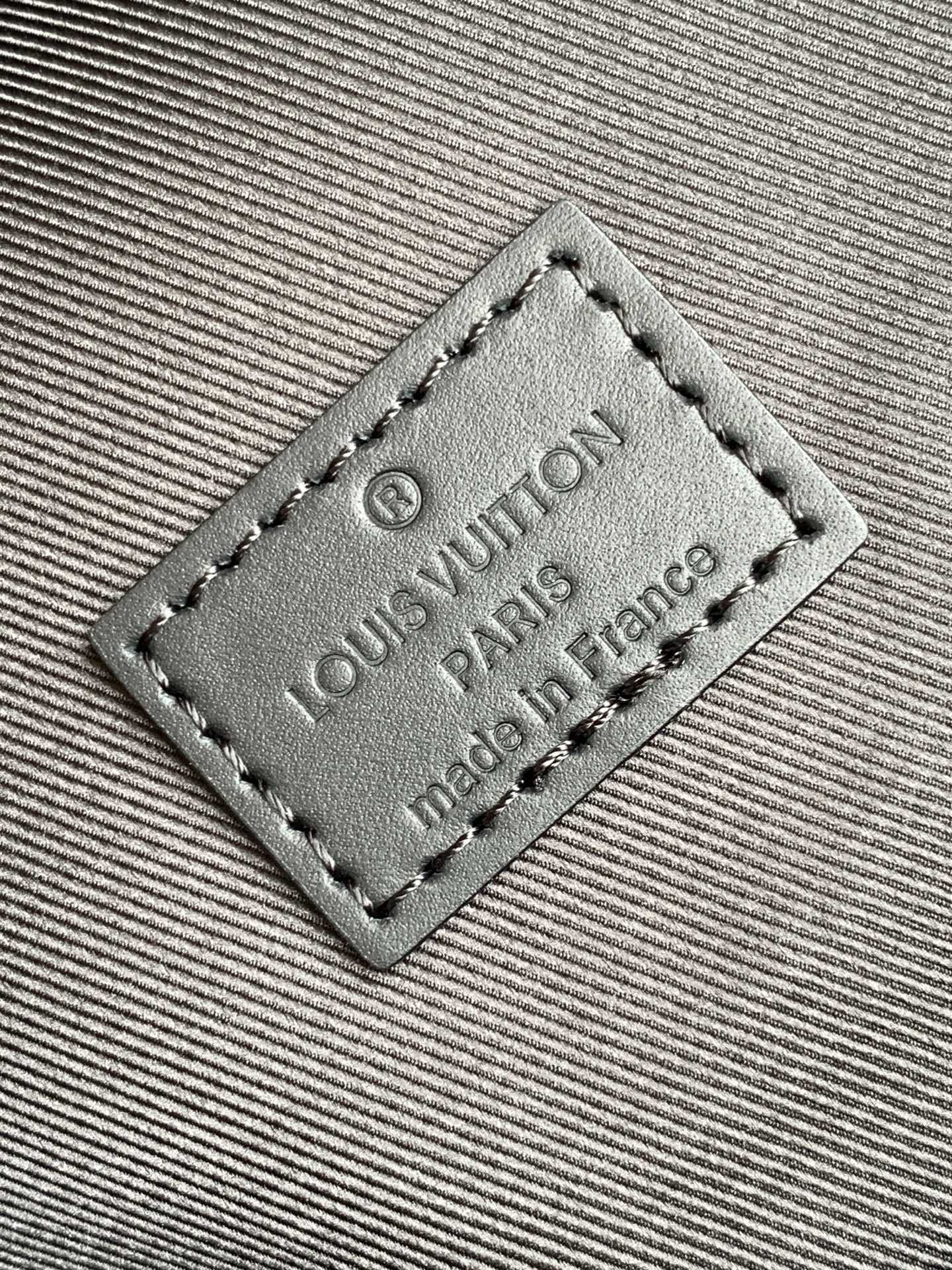 Louis Vuitton monogram backpack interior leather label embossed "Louis Vuitton Paris"