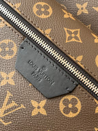 Louis Vuitton monogram backpack zipper pull leather tab embossed "Louis Vuitton Paris"