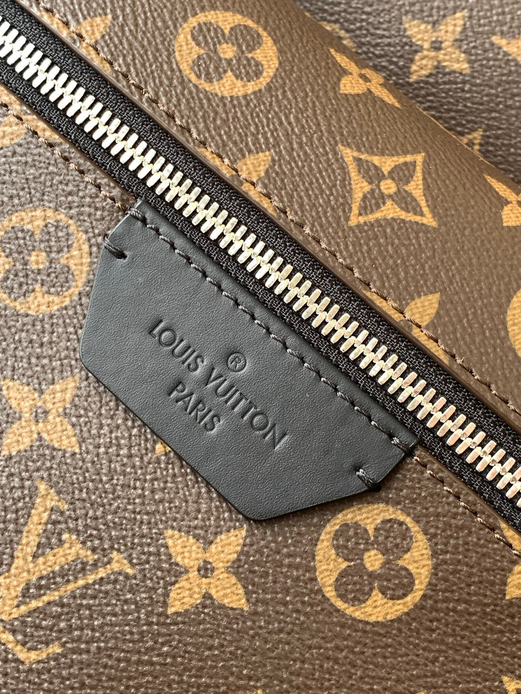 Louis Vuitton Paris leather tag on monogram zipper pocket with silver zipper teeth