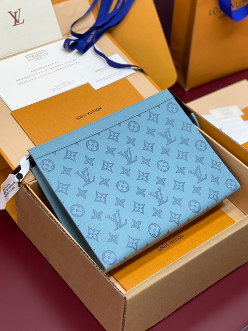 Louis Vuitton small blue monogram bag with blue strap and zip-top opening