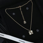 Chanel silver-tone long chain necklace with pearl flower pendant and logo