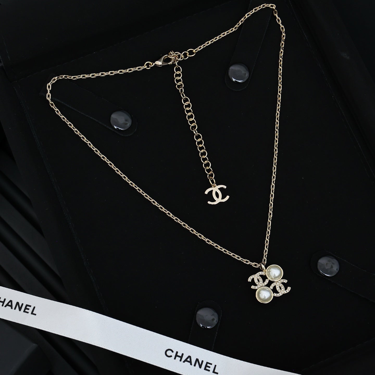 Chanel silver-tone long chain necklace with pearl flower pendant and logo