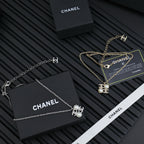 Chanel silver-tone pendant necklaces with pearl flower charms, chain and clasp