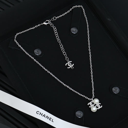 Chanel silver-tone long chain necklace with pearl flower charm and logo detail