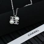 Chanel silver-tone pendant necklace with round pearl charms and logo links