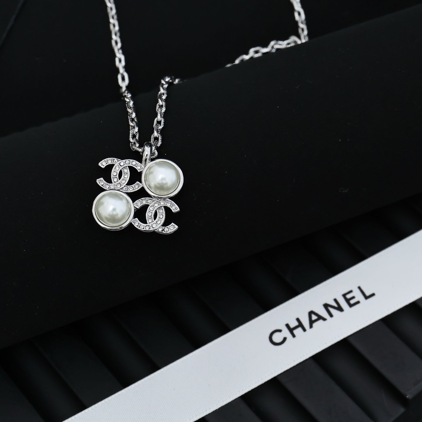 Chanel silver-tone pendant necklace with round pearl charms and logo links
