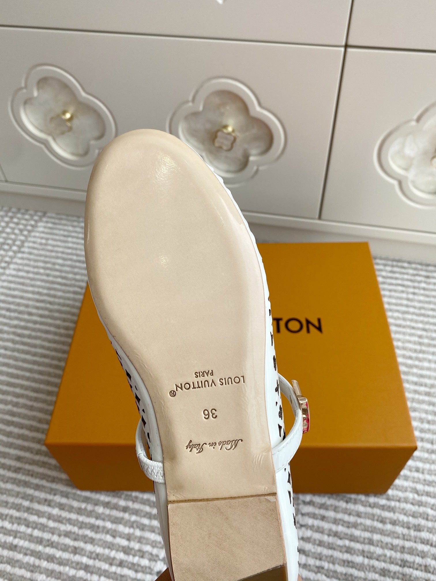 Louis Vuitton logo-pattern flats with white strap, outsole and interior lining detail view