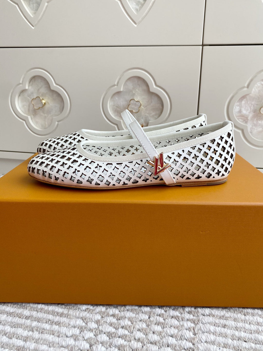 Louis Vuitton logo-pattern ballet flats with white strap and low profile sole, side view