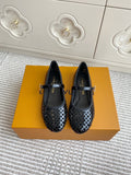 Black patterned flat ballerina shoes with adjustable buckle strap, pair on box