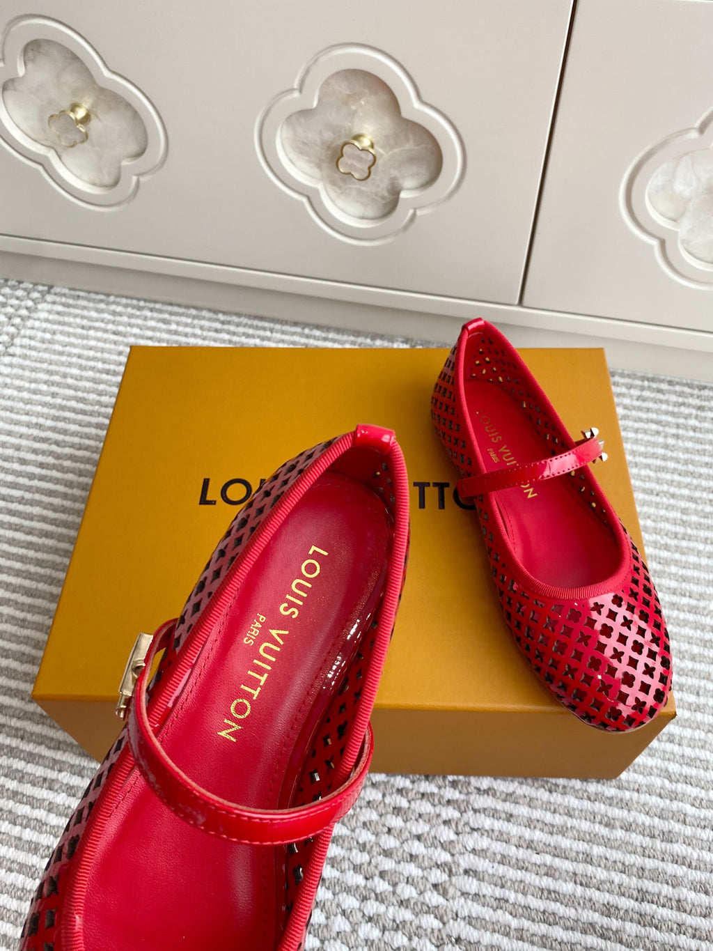 Women's Louis Vuitton red flats with logo-printed insole and front strap