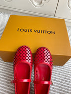 Women's Louis Vuitton red flats with front strap and perforated lattice design