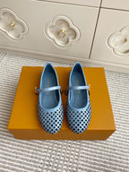Blue perforated ballet flats with light blue strap and lattice pattern