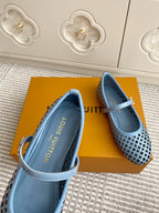 Close-up of interior lining and light blue perforated flats with strap