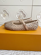 Women’s Louis Vuitton monogram flats, cream upper with repeating pattern, single front strap.