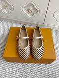 Women’s Louis Vuitton monogram flats, cream leather, perforated pattern, white strap with buckle.