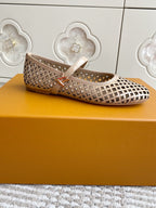 Women’s Louis Vuitton monogram flats, cream mesh-style pattern, ankle strap with gold-tone buckle.