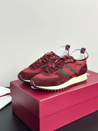Ladies dark red lace-up sneakers with green stripes, cream midsole and textured outsole