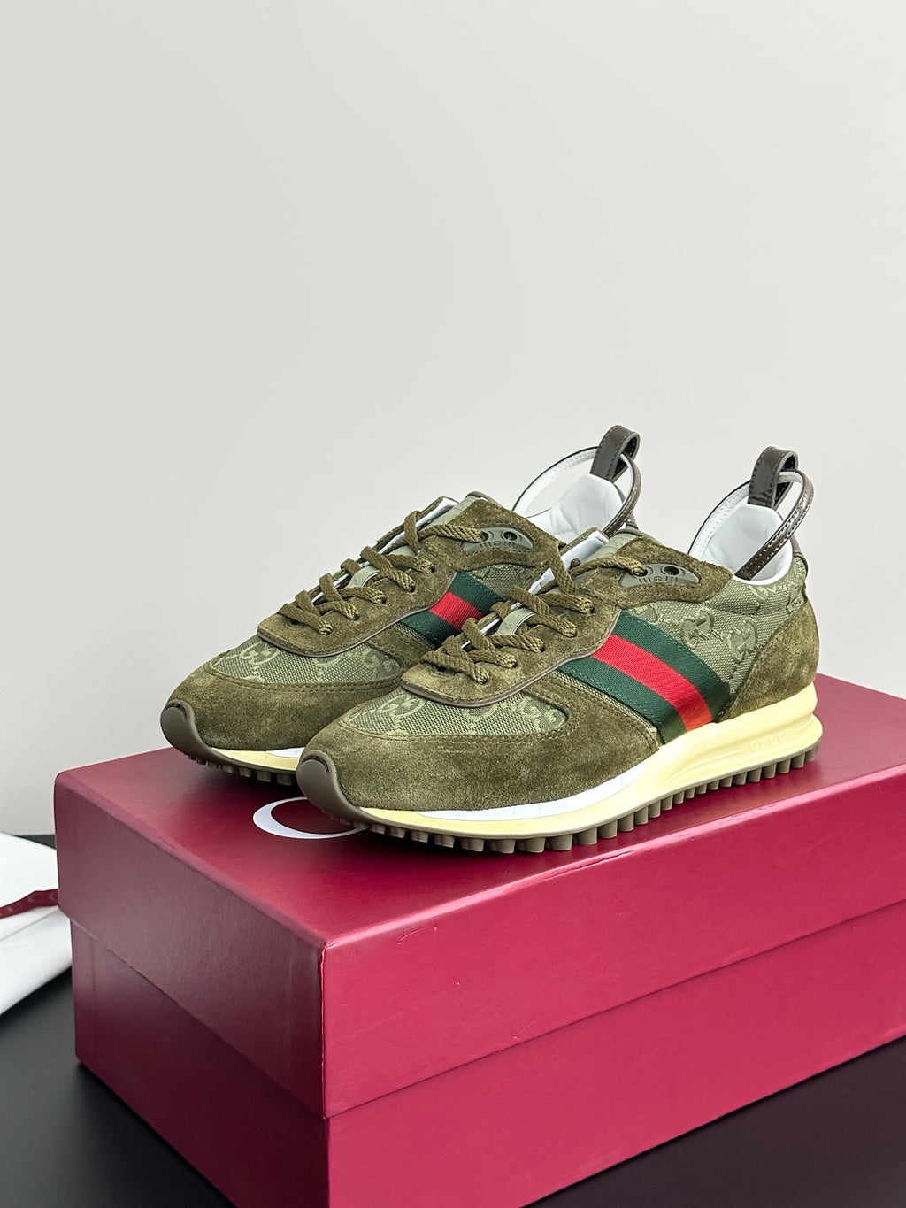 Olive Gucci ladies sneakers, angled front view with green laces, Web stripe, cream sole