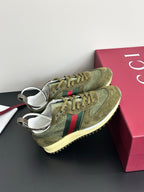 Olive Gucci ladies sneakers, side view with green laces and Web stripe, cream sole