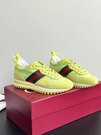 Women's Gucci lace-up sneakers in lime yellow suede with side stripe and textured sole