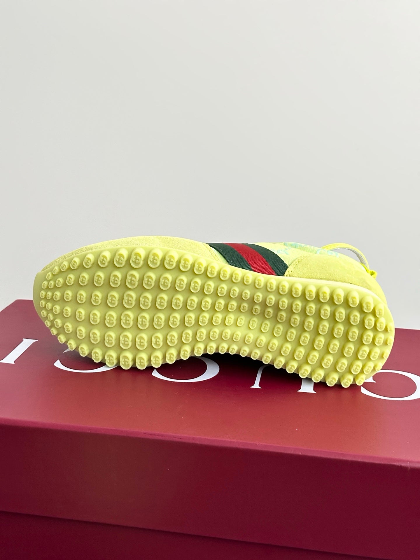 Women's Gucci sneaker outsole in lime yellow rubber with tread and green-red stripe panel
