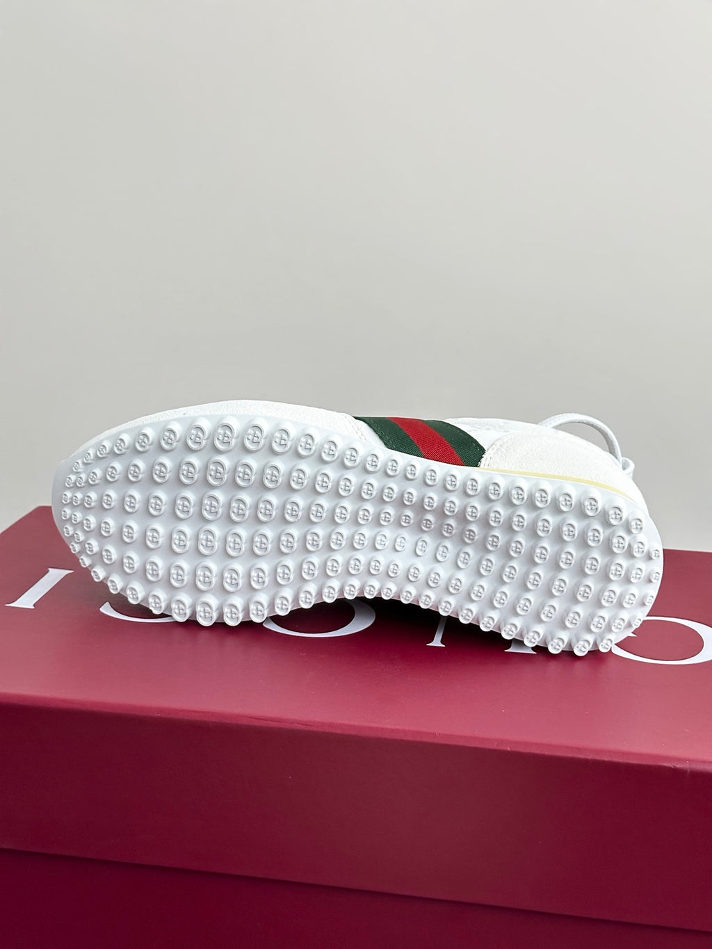 Gucci white sneaker outsoles with studded rubber tread and green-red stripe