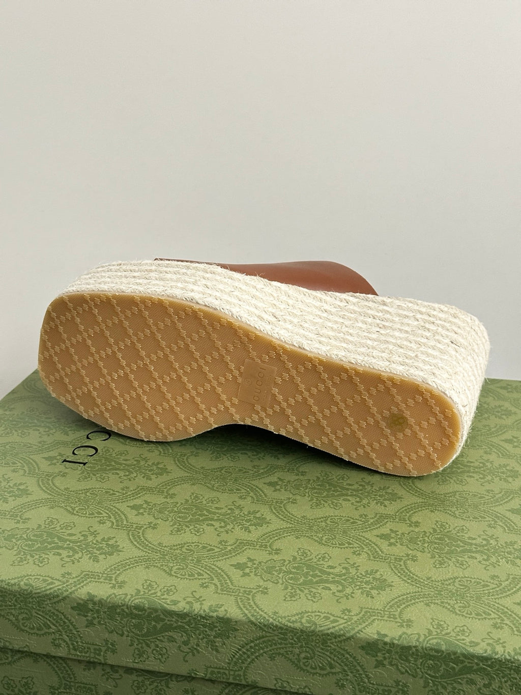 Gucci brown wedge slide sandals, sole side view on textured espadrille platform