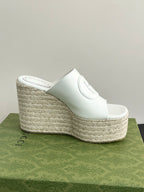 White Gucci platform slide wedge with slip-on strap and woven textured platform side
