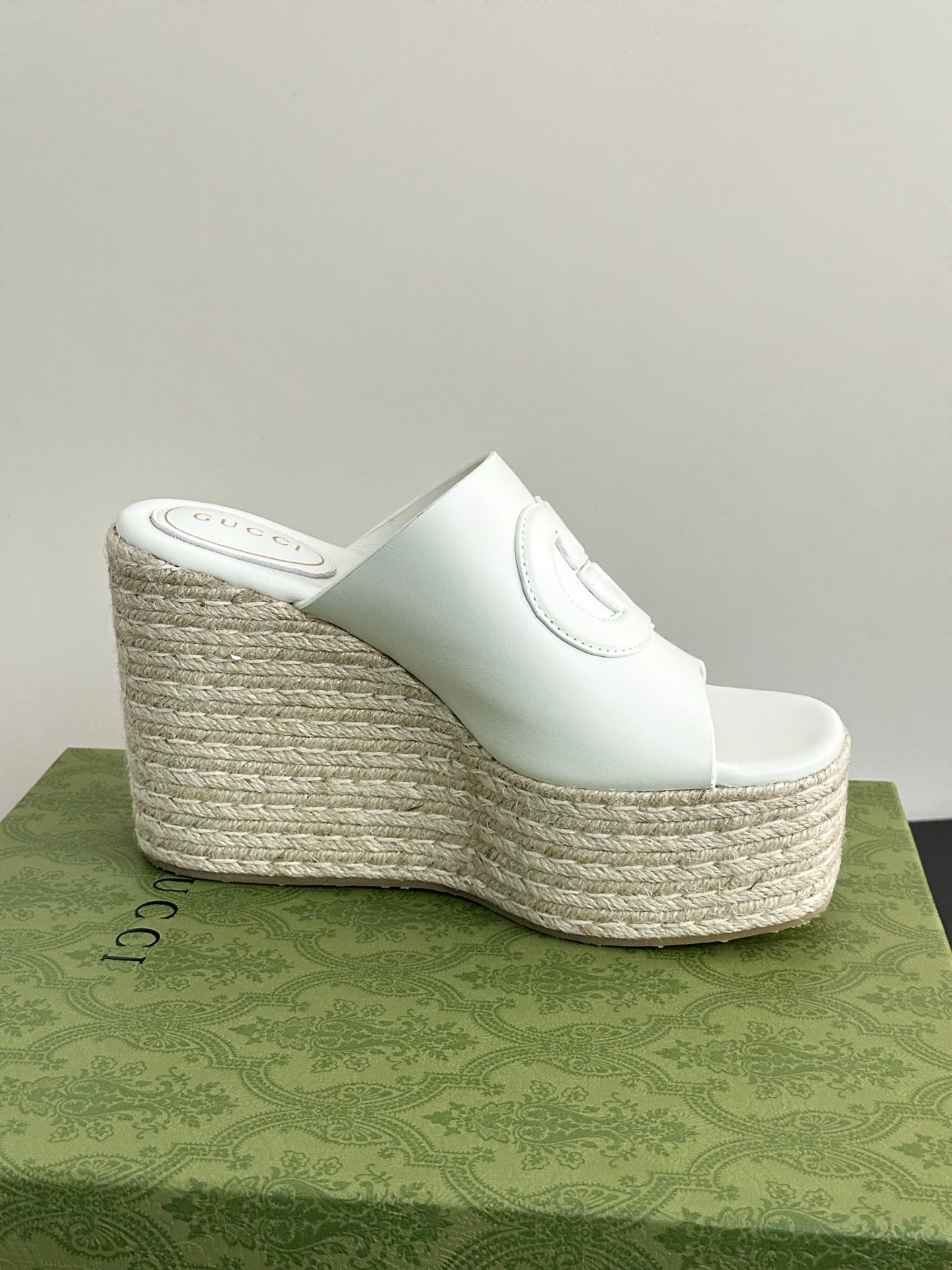 White Gucci platform slide wedge with slip-on strap and woven textured platform side