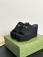 Gucci womens luxury shoes, dark platform slide mule with gold horsebit detail