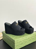 Gucci womens luxury shoes, dark wedge slide mules with gold horsebit on straps