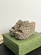 Gucci ladies’ platform slide sandals, beige-brown GG print with gold horsebit on upper