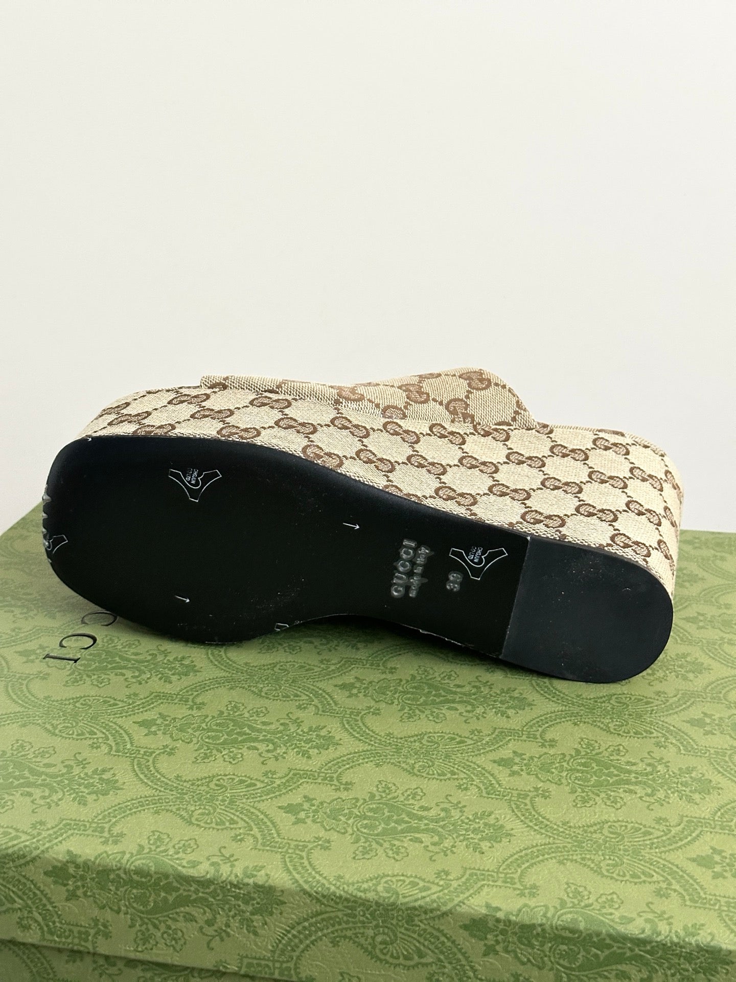 Gucci ladies’ platform slide sandal outsole view on beige-brown GG canvas base
