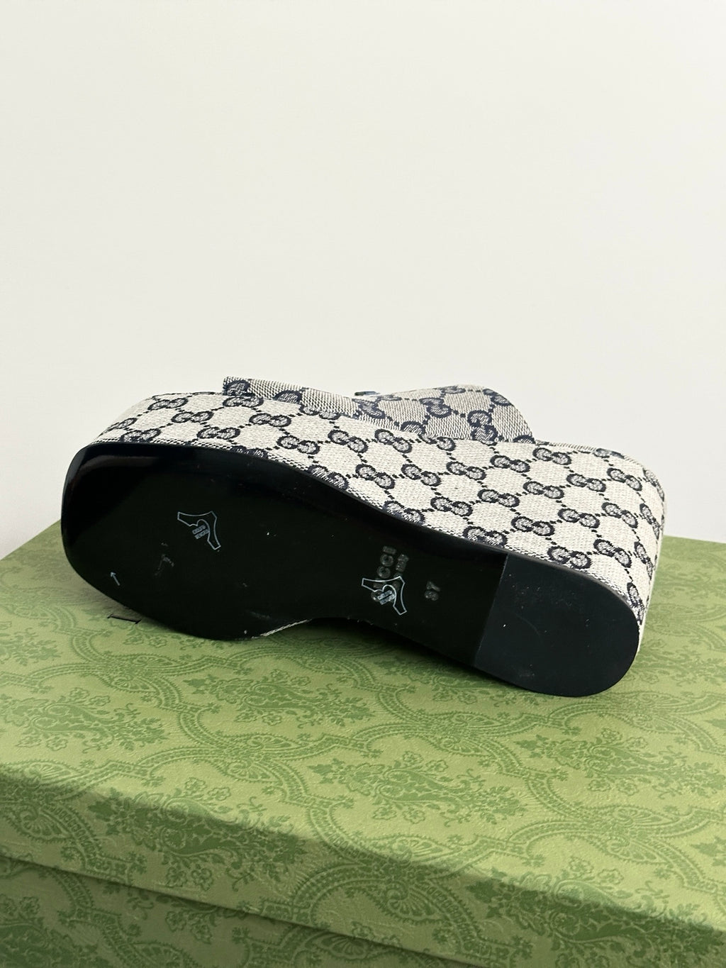 Gucci GG-print platform slide sandals, outsole view with open-toe profile.