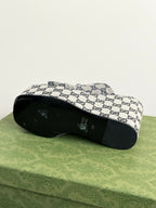 Gucci GG-print platform slide sandals, outsole view with open-toe profile.