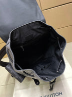 Backpack interior view with open top, dark lining, and zipper closure at edge