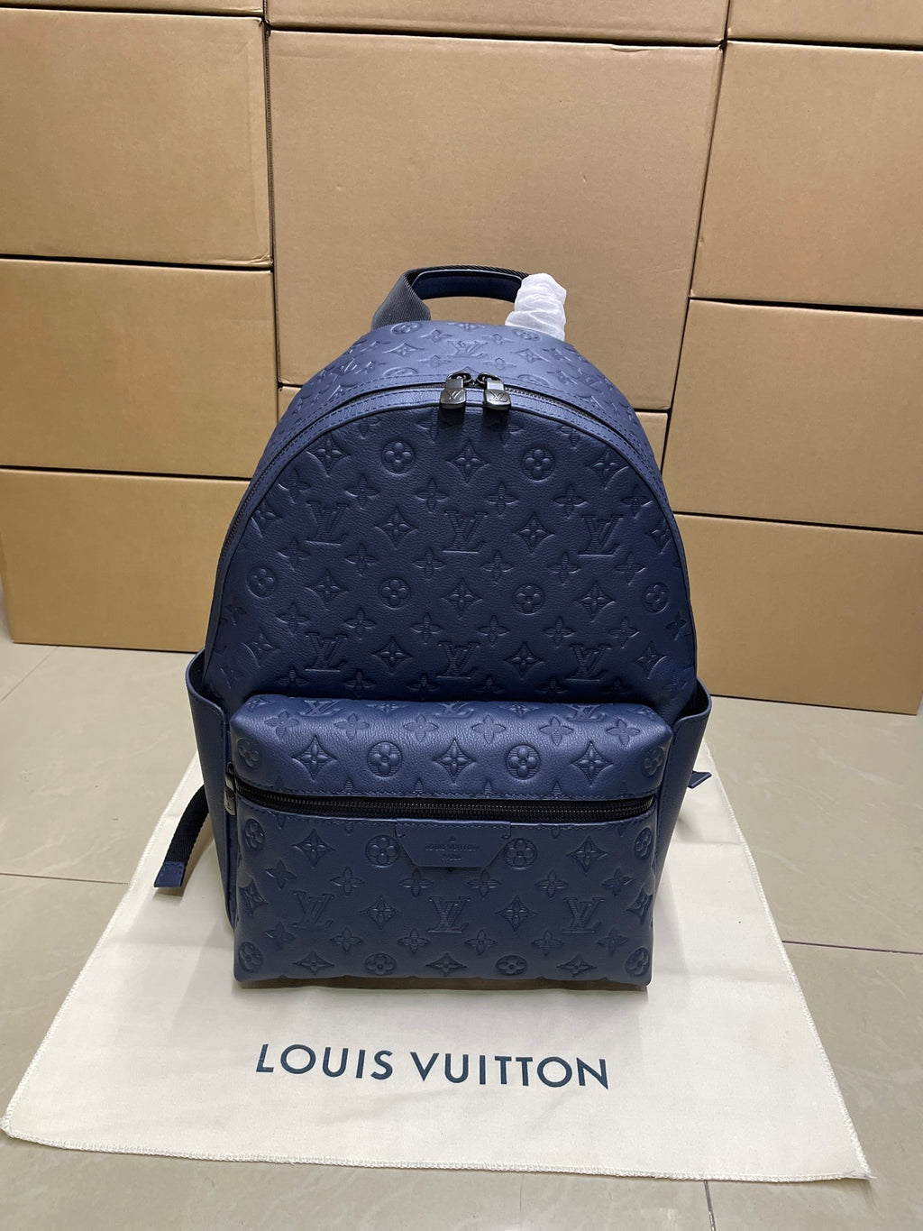Navy monogram mini backpack with top handle and front zip pocket