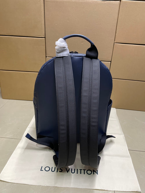 Louis Vuitton monogram backpack in navy blue, back view with adjustable shoulder straps