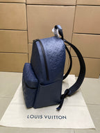 Navy monogram mini backpack with side zip and adjustable shoulder strap