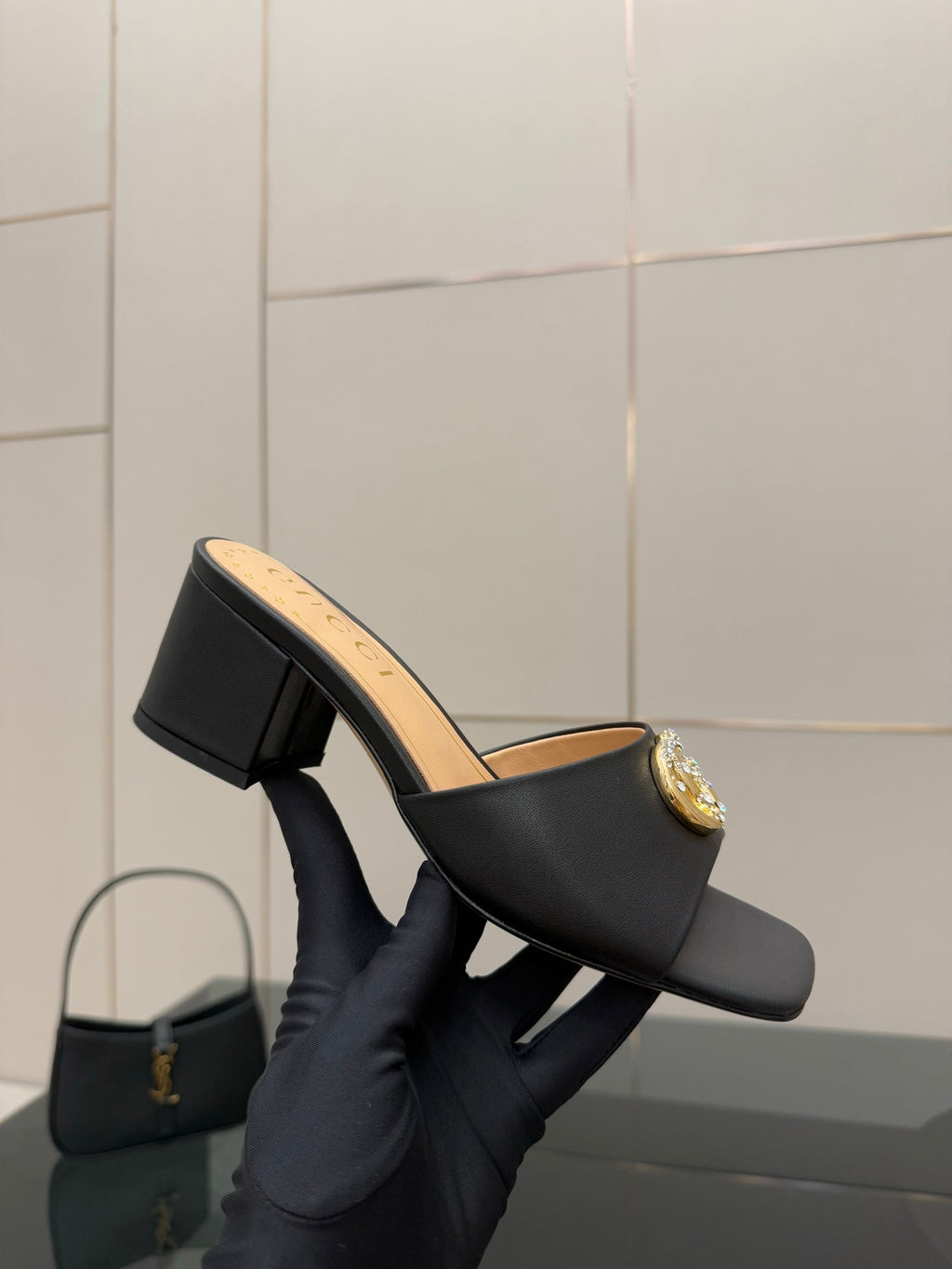 Black mule sandal with gold-tone GG buckle and chunky block heel