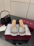 Gucci women's silver mule slides with gold logo hardware and block heel