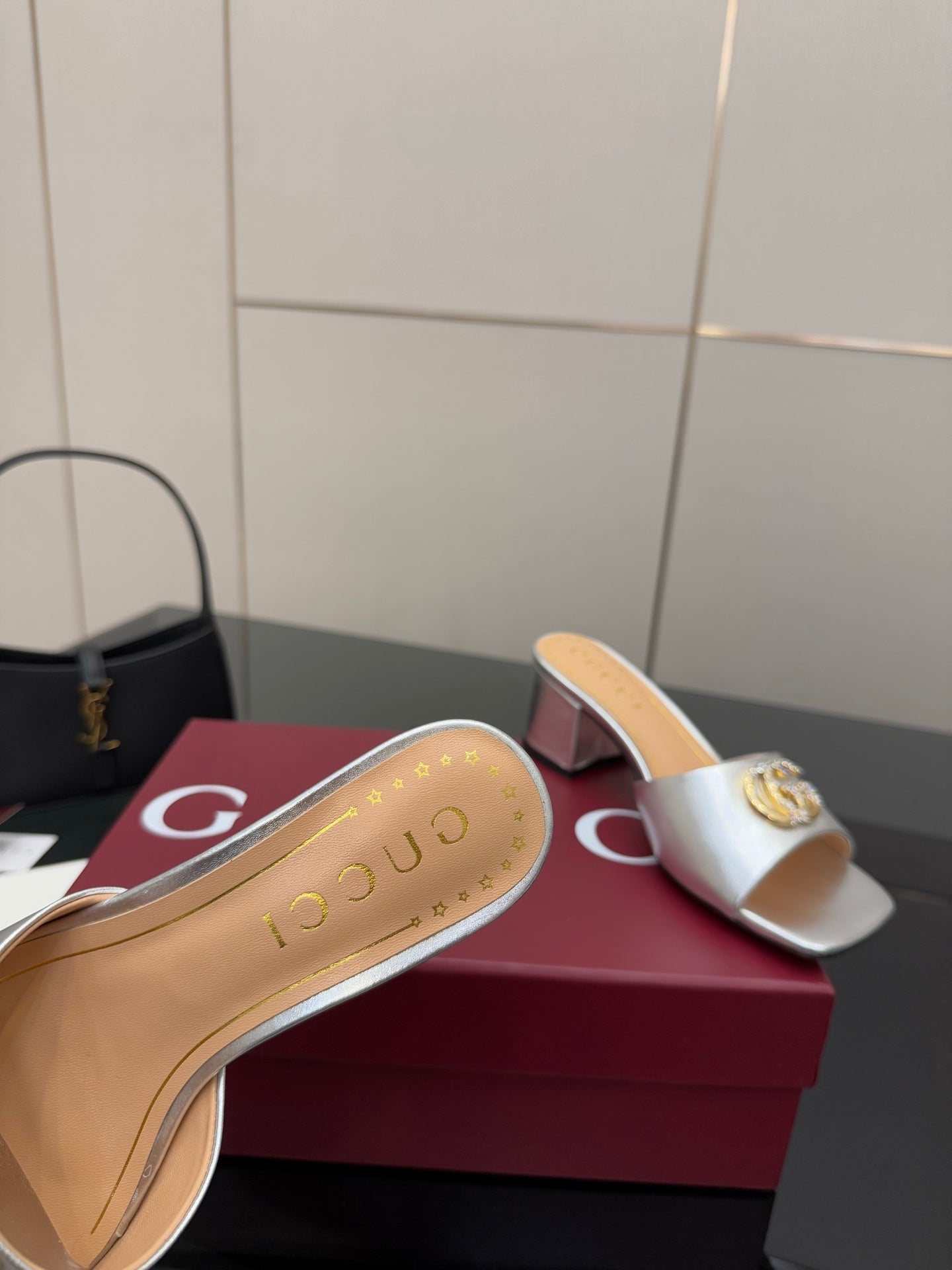 Gucci women's silver mule slide insole with embossed logo on the footbed